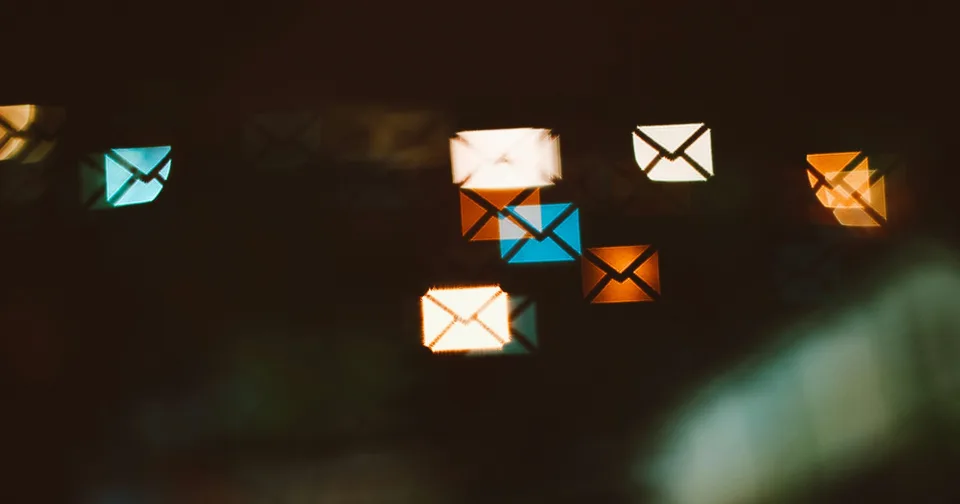 Illuminated envelopes representing incoming email messages