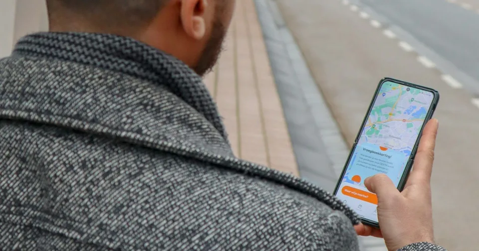 Checking a map on a phone while walking through the city