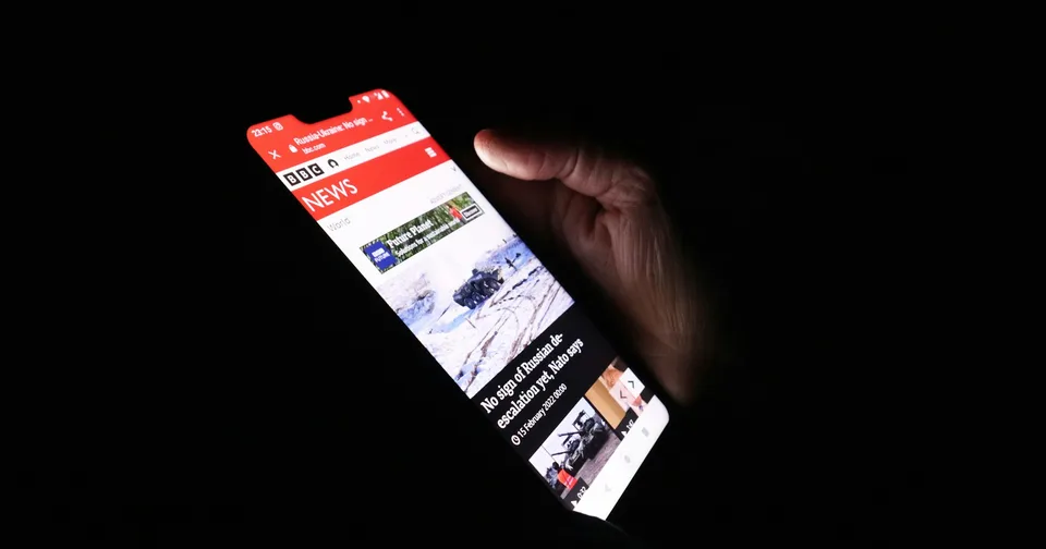 A person browsing a website on a smartphone